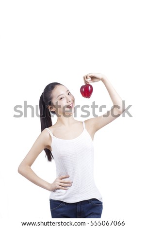 	young woman with a red apple in her hand	