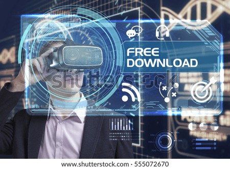 Business, Technology, Internet and network concept. Young businessman working in virtual reality glasses sees the inscription: free download 
