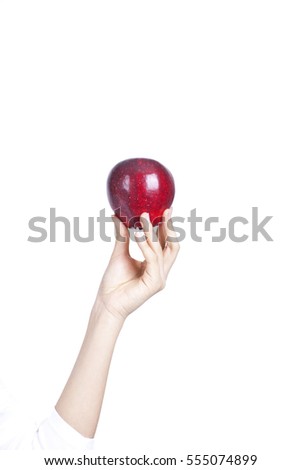	a red apple in a lady's hand	