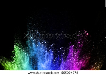 abstract colored dust explosion on a black background.abstract powder splatted background,Freeze motion of color powder exploding/throwing color powder, multicolored  glitter texture.