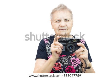 The photo shows a pensioner with a camera