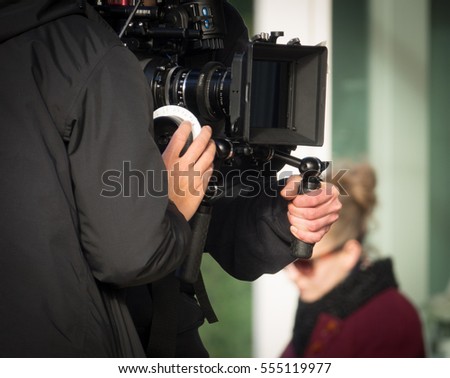 A Cameraman Shooting A Movie