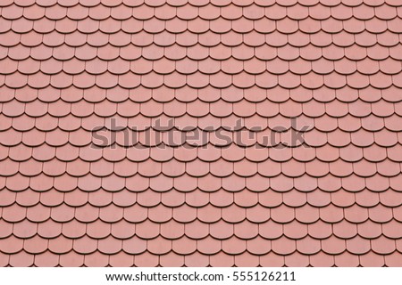 Old terracotta roof tiles, close-up Royalty-Free Stock Photo #555126211