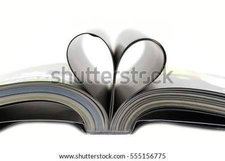 Book with opened pages of heart shape  isolated on white background