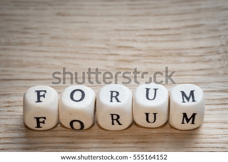 Forum word on a wooden cubes with a copy space above