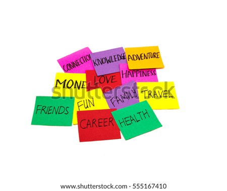 Stack of colorful sticky notes with lots of choices and decisions to make about life priorities isolated on white background. Concept of attention in family, career, hobbies. Healthy work-life balance
