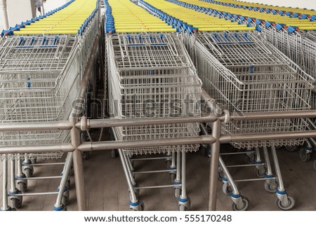 empty shopping carts in the big supermarket