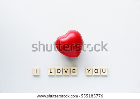 Red Heart I LOVE YOU text word made with wood blocks on table .Valentine Concept.