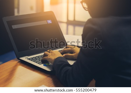 business people search web and technology concept of using internet browser on laptop computer on table 