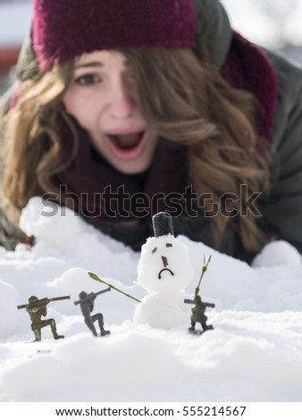 War between the big snowman and the little soldiers
