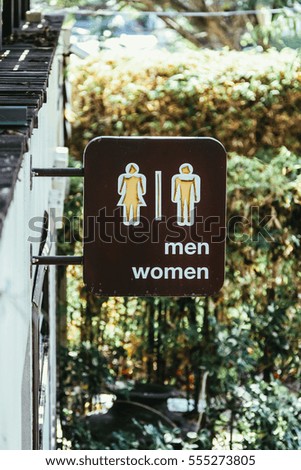 Toilet sign outside of a building