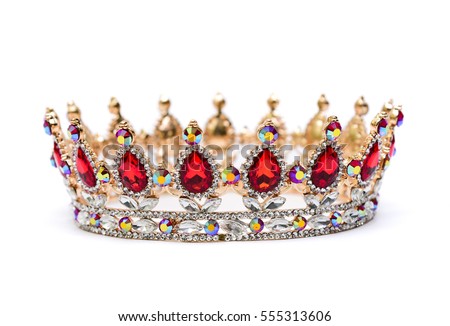 Gold crown of queen with red and white jewel of precious stones. Royalty-Free Stock Photo #555313606