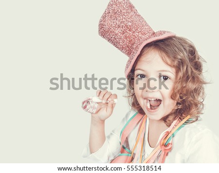 beautiful five year old girl with whistle  Royalty-Free Stock Photo #555318514