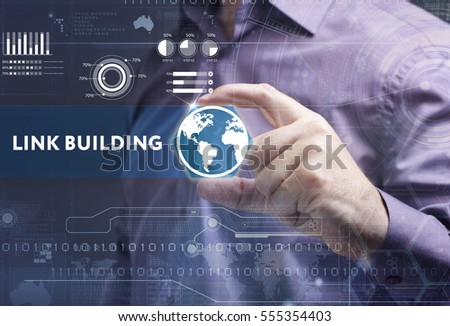 Business, Technology, Internet and network concept. Young businessman working on a virtual screen of the future and sees the inscription: link building 