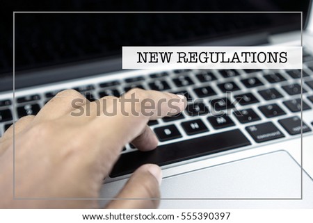 Business Concept with NEW REGULATIONS wording