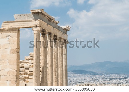 Detail of the columns of the Parthenon with the skyline of Athens on the background, Greece