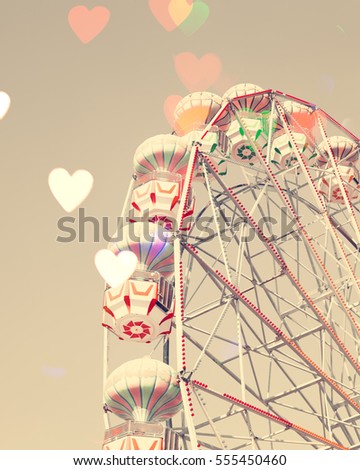 VIntage Ferris Wheel with bokeh hearts