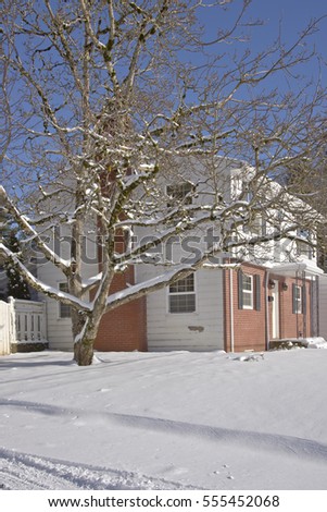 Family home and snow covered ground Gresham Oregon.