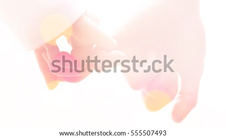 Happy couple holding hands together as forever love with Vintage filter, Valentine day background. Royalty-Free Stock Photo #555507493