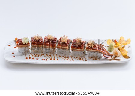 Unagi Sushi : Japanese Rice Wraped Avocado and Cheese Topping with Grilled Unagi (Japanese Freshwater Eel) and Katsuobushi (dried, fermented, and smoked skipjack tuna).