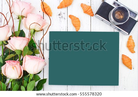 Travelling Concept with Vintage Camera on White Wooden Background and Pink Rose Bouquet, Flat Lay Style, Chalkboard Free Text Space