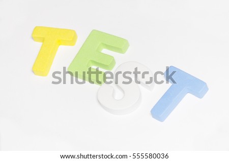 word test using colourfull block alphabet on white background