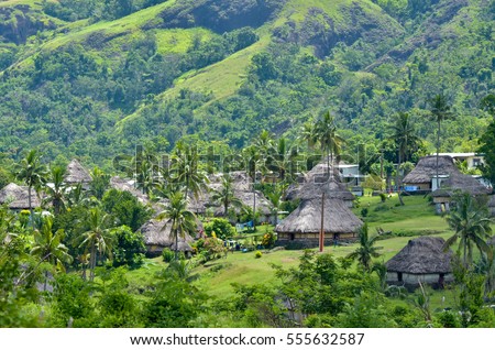 Aerial view of Navala village in the Ba Highlands of northern-central Viti Levu, Fiji. It is one of the few settlements in Fiji which remains fully traditional architecturally. Royalty-Free Stock Photo #555632587