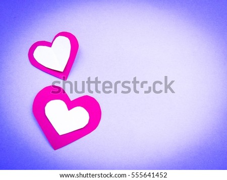 Fold paper Red White  hearts {Paper Heart stacked}, Heart of paper folding Isolated on Purple Blue Background. Cards for Valentine's Day There is space for text "Happy Valentine's Day"