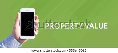 Smart phone in hand front of green background and written PROPERTY VALUE