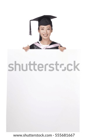 	A female graduate in dressed and whiteboard	