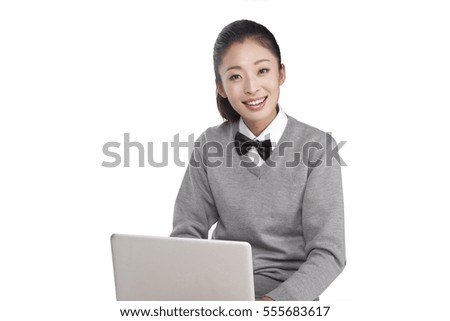 	A female student sit and using computer	