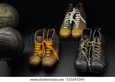 Old football boots Royalty-Free Stock Photo #555691045
