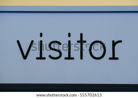 The word visitor as a sign in blue and black. Clean image of the word visitor with possible uses including with web page visitor counters.