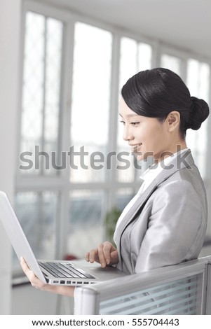 Young business woman using computer	