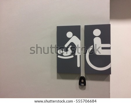 The symbol of priority that is mother take care baby and man sit on wheel chair,there is space for insert text or massage.