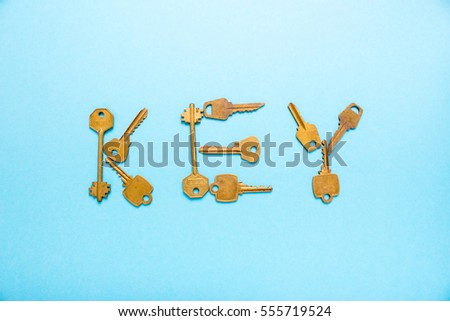 Key word is written inlaid keys on a blue background
