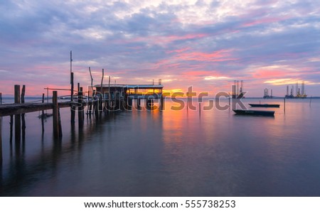 Sunrise at beach with old jetty at Tanjung Langsat Johor Malaysia. 