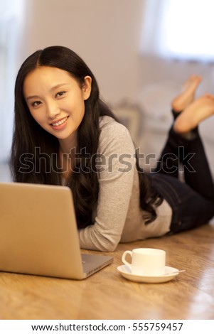 	Young woman surfing the net	
