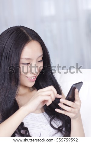 	Young woman texting	