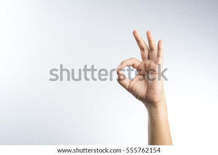 hand ok sign on white background Royalty-Free Stock Photo #555762154