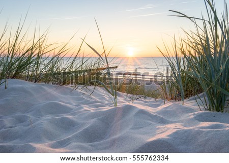Sunset at the Baltic sea Royalty-Free Stock Photo #555762334