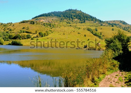 Lake and landscape in The Apuseni Mountains, a mountain range in Transylvania, Romania, which belongs to the Western Romanian Carpathians