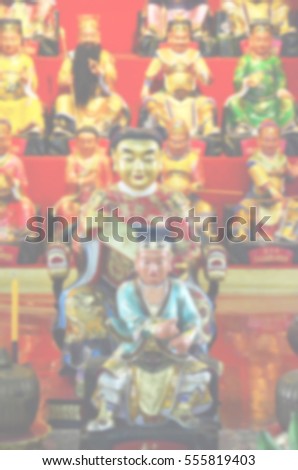 Blurred  background abstract and can be illustration to article of Chinese god statue