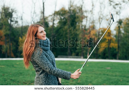woman making selfie on mobile phone camera