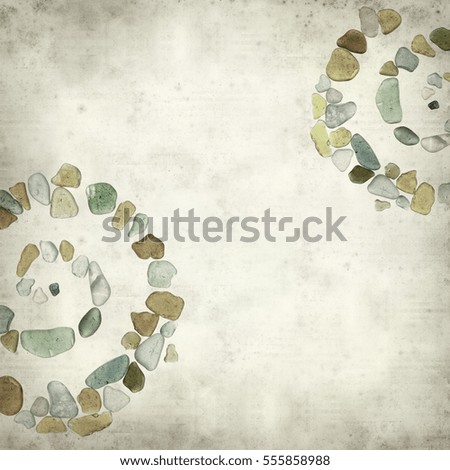 textured old paper background with sea glass pieces 