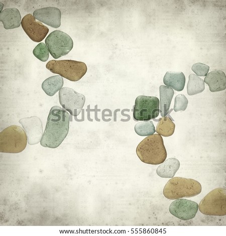 textured old paper background with sea glass pieces 