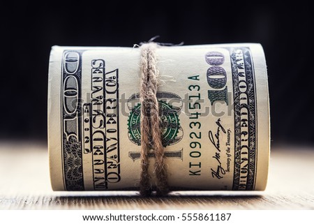 Close-up rolled American dollars banknotes.