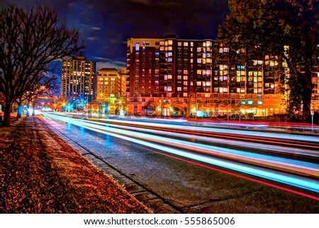 Exterior nighttime long exposure HDR stock photo of traffic along Lake Drive bordering Lake Calhoun in Uptown in Minneapolis, Minnesota 
