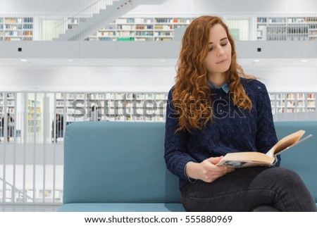 Clever University Student Studying in White Modern Library Books