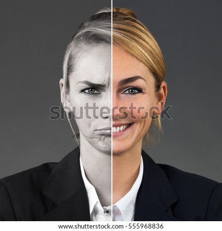 Two Side Face Of Young Woman Showing Different Emotions On Grey Background Royalty-Free Stock Photo #555968836